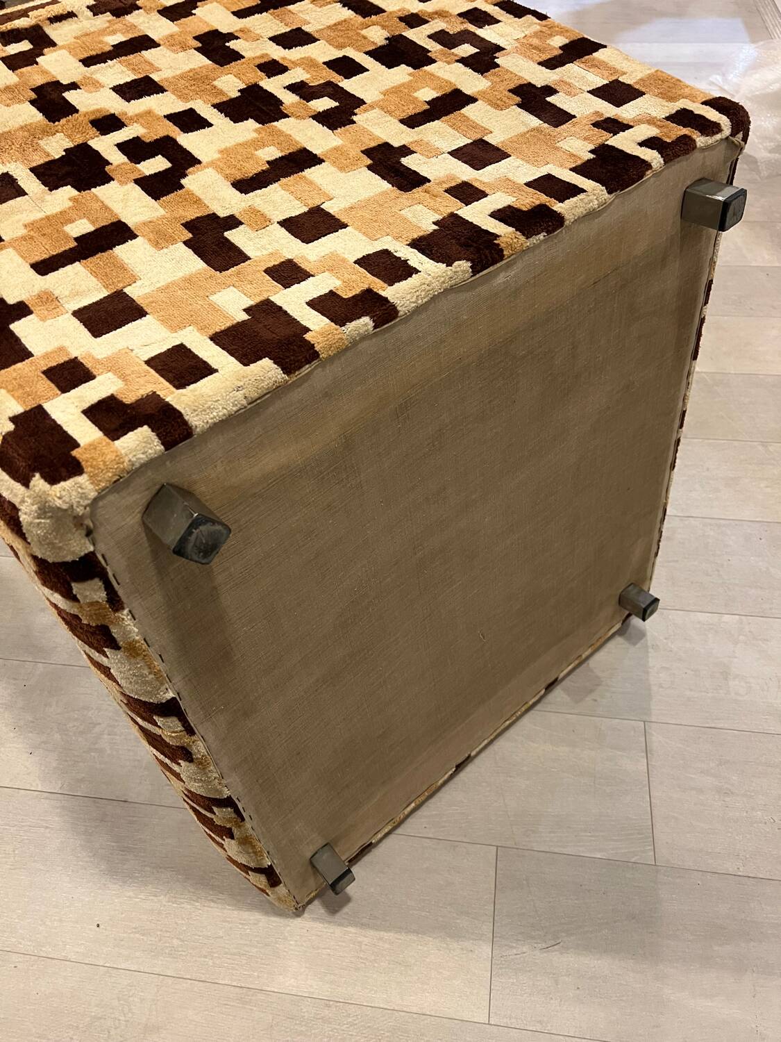 Vintage armchair from the 70s in beige and brown.