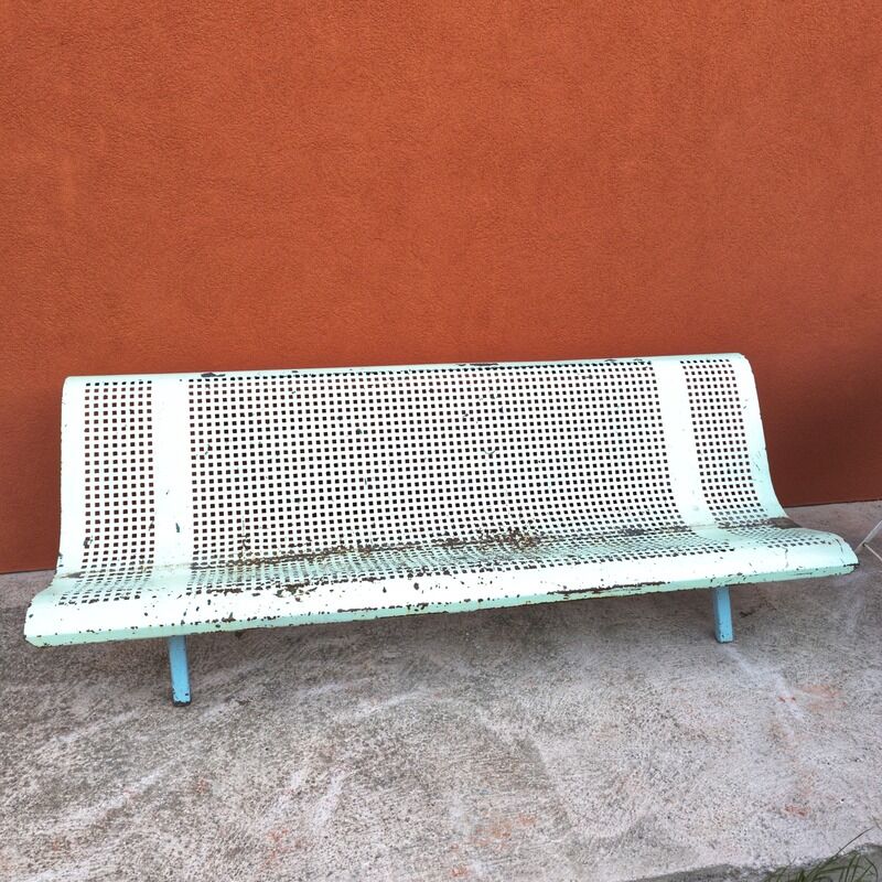 Public bench made of perforated iron