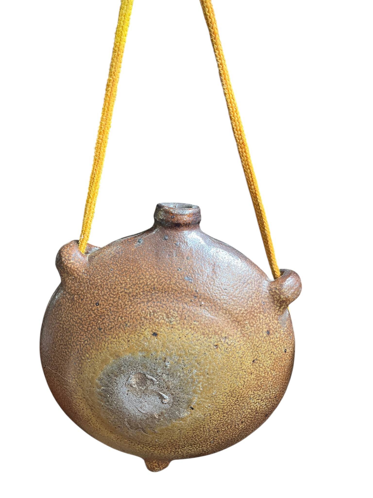 Old stoneware flask known as a toad from the 19th century.