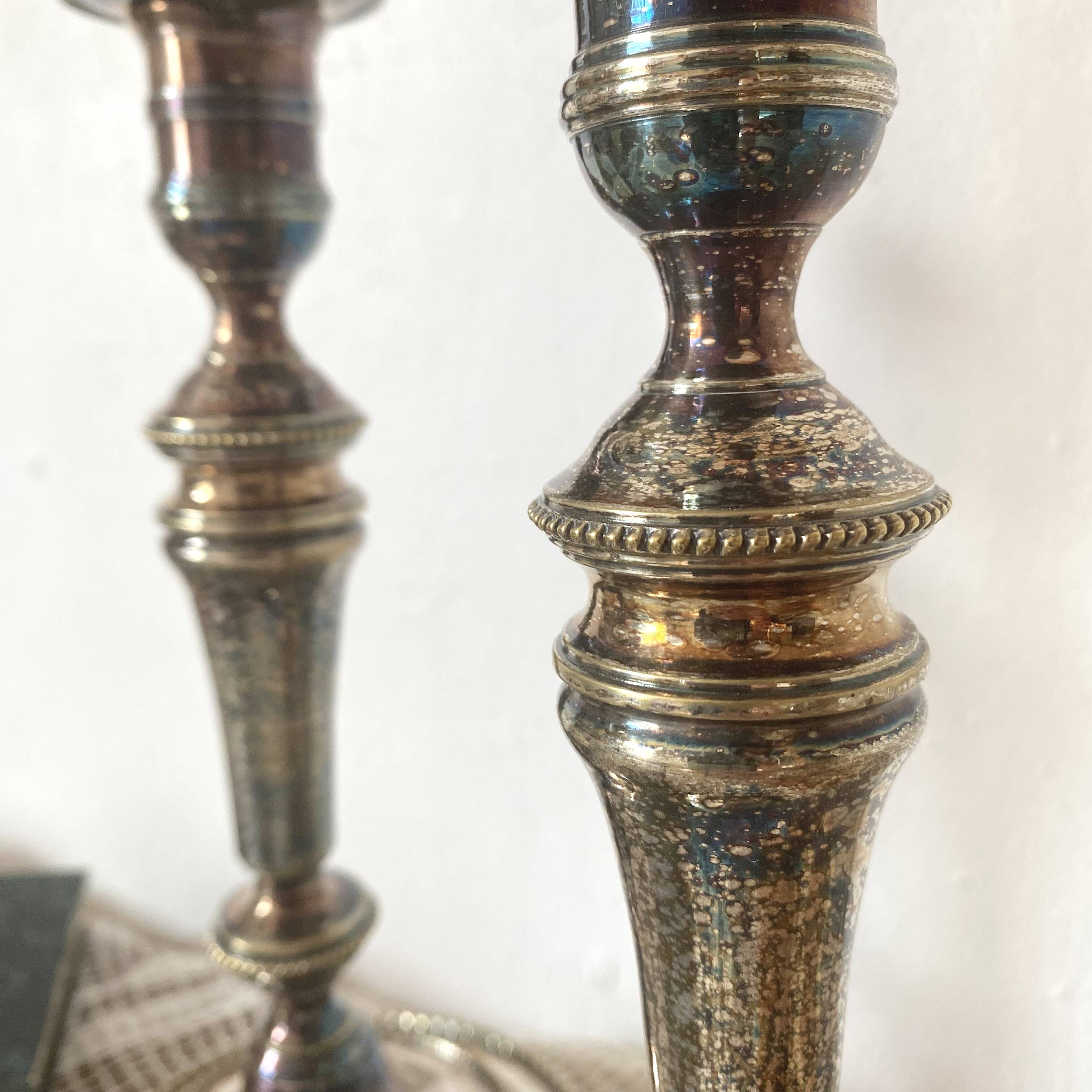 Pair of silver-plated metal candlesticks
