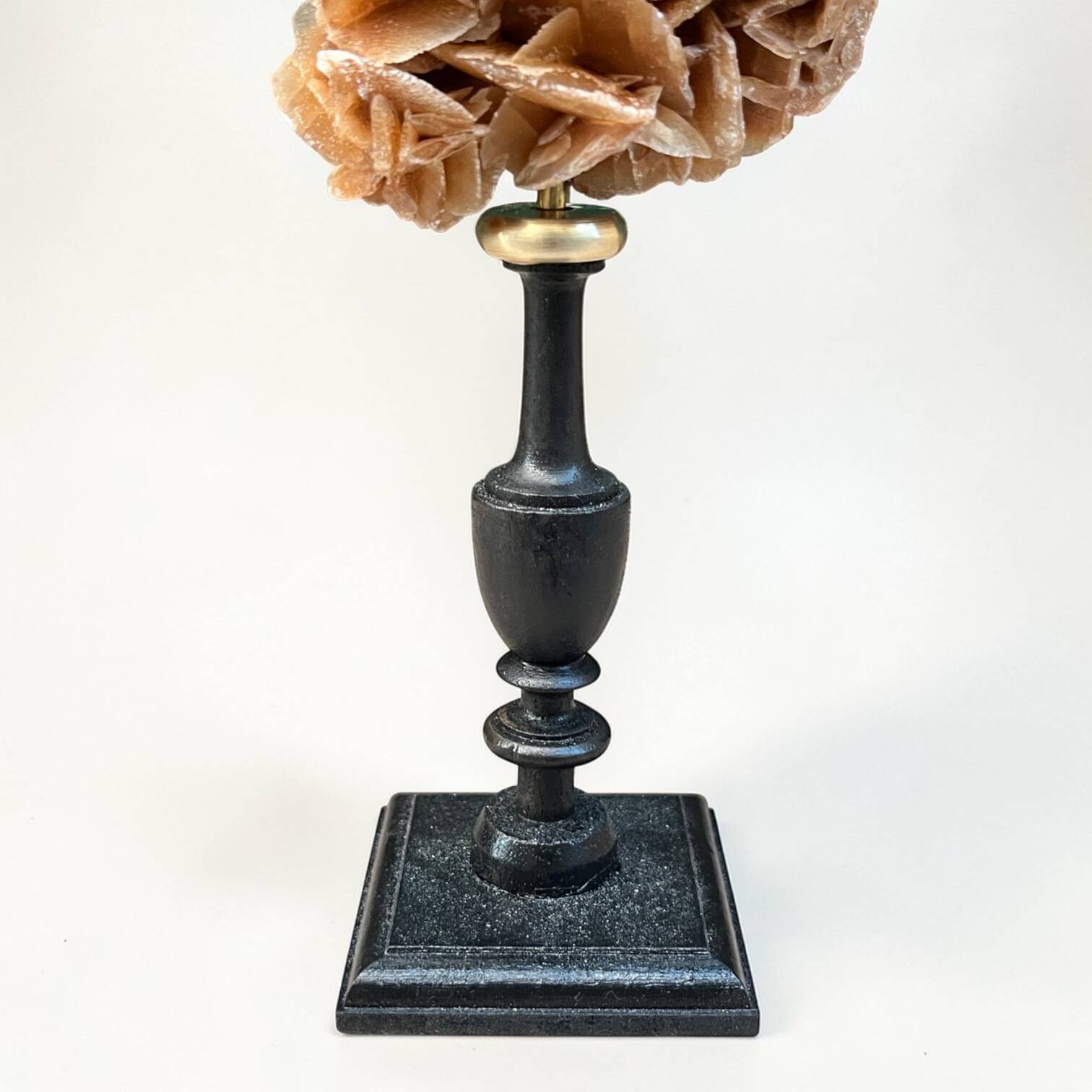 Sand rose on a turned black wooden base, late 19th century curiosities.