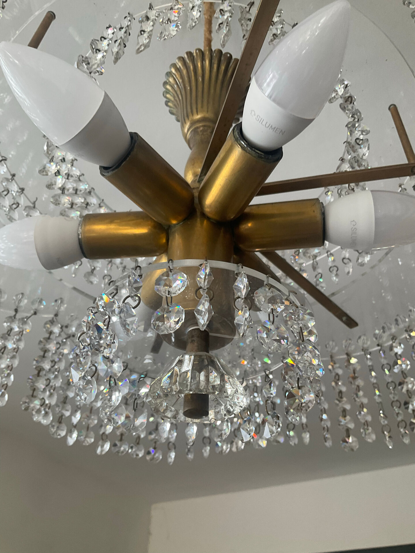 Vintage lucite chandelier with a cascade of crystal pendants from the 1970s.
