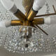 Vintage lucite chandelier with a cascade of crystal pendants from the 1970s.