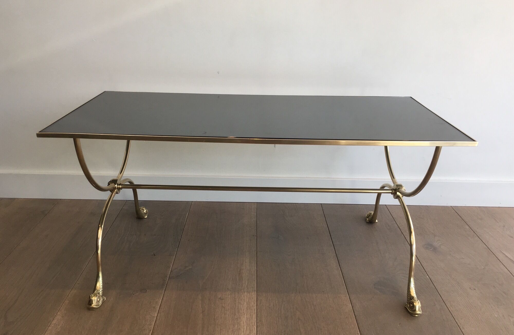 Neoclassical brass style coffee table with dolphin head decoration