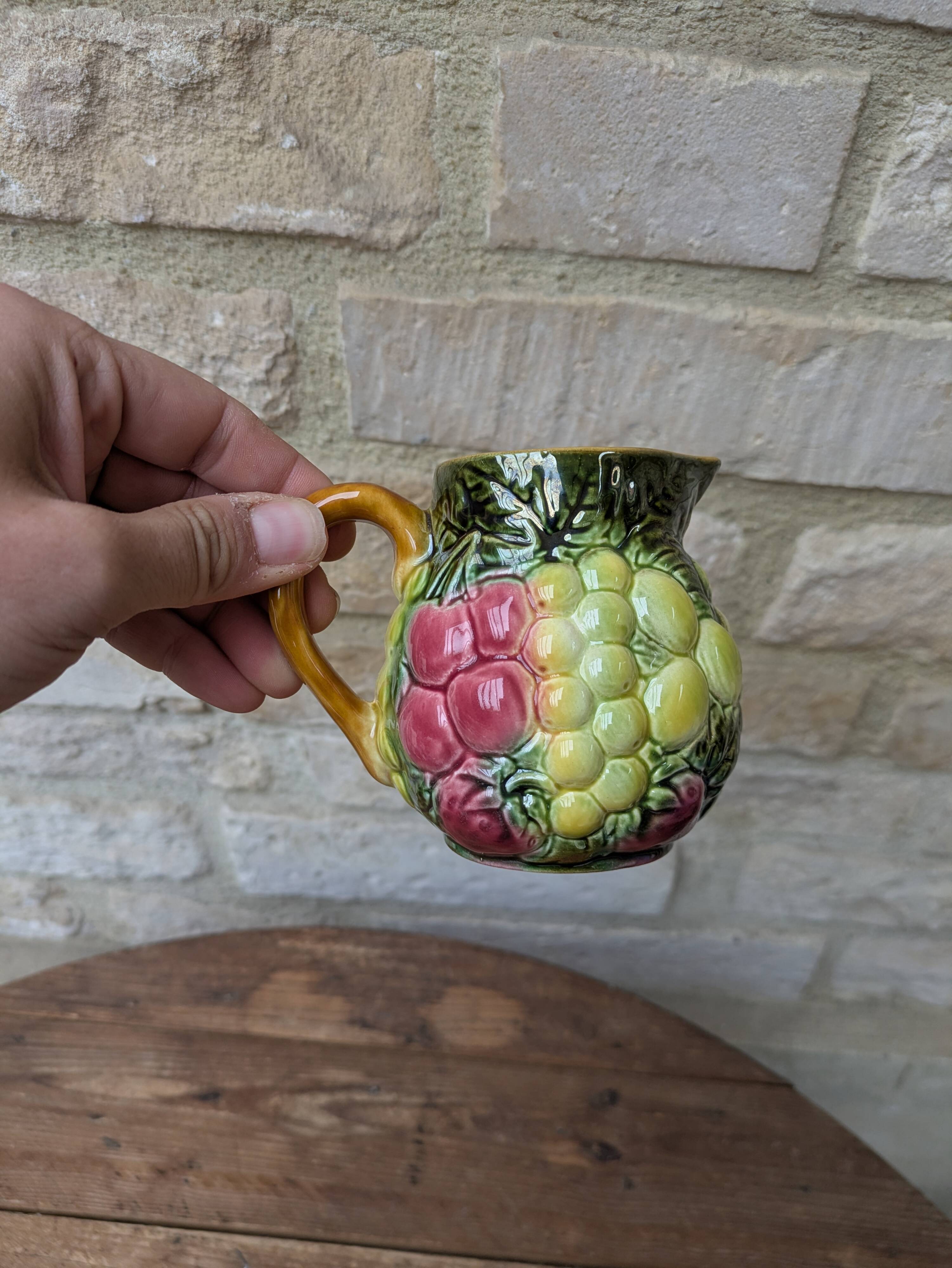 Small jug, milk pot in slipware with relief fruits Salins les Bains