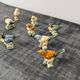 Set of 11 miniature birds in polychrome glazed ceramic.