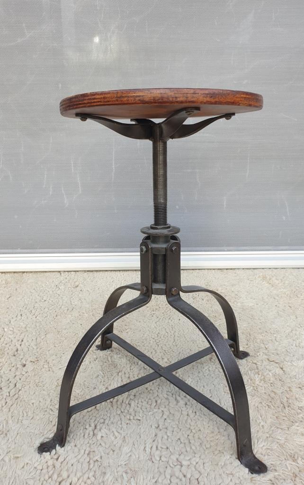 Bienaise stool of the years 1935, model 203 with 4 flat iron cathedral legs joined by a