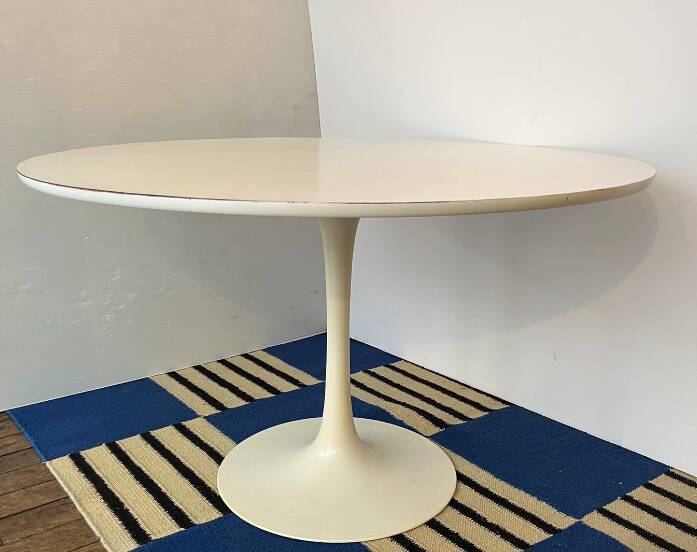 White dining table with tulip base by Maurice Burke