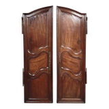 Pair of Louis XV period molded doors in solid walnut
