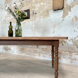 Vintage farmhouse table with turned legs.