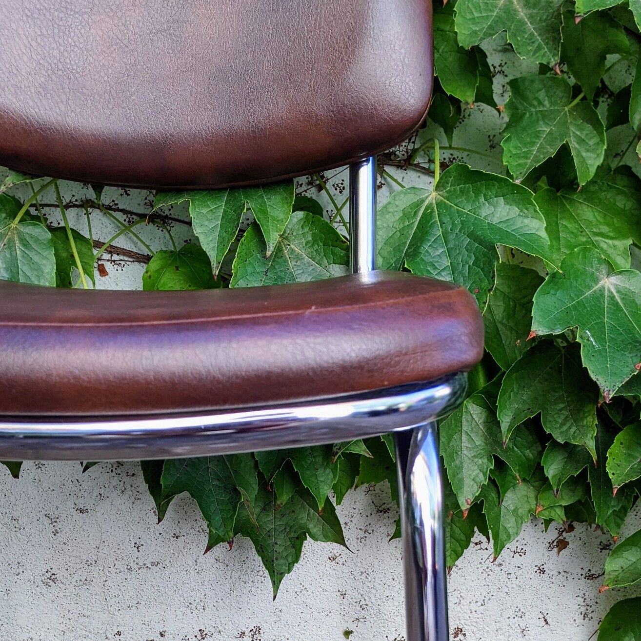70s metal and imitation leather chairs