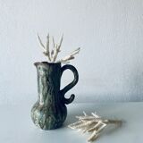 Old pitcher in glazed terracotta