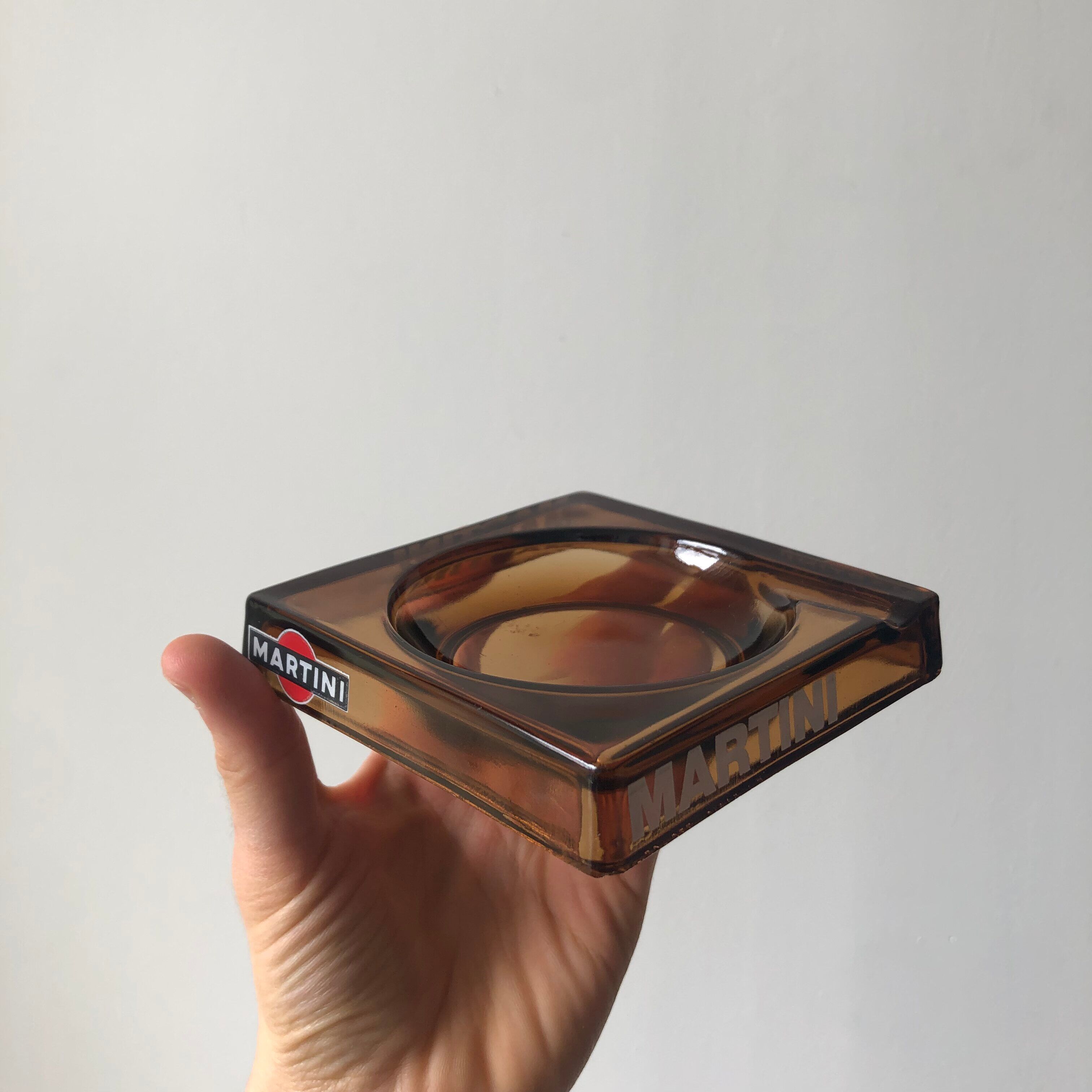 Square advertising ashtray of the Martini brand in smoked glass, elegant and retro style.