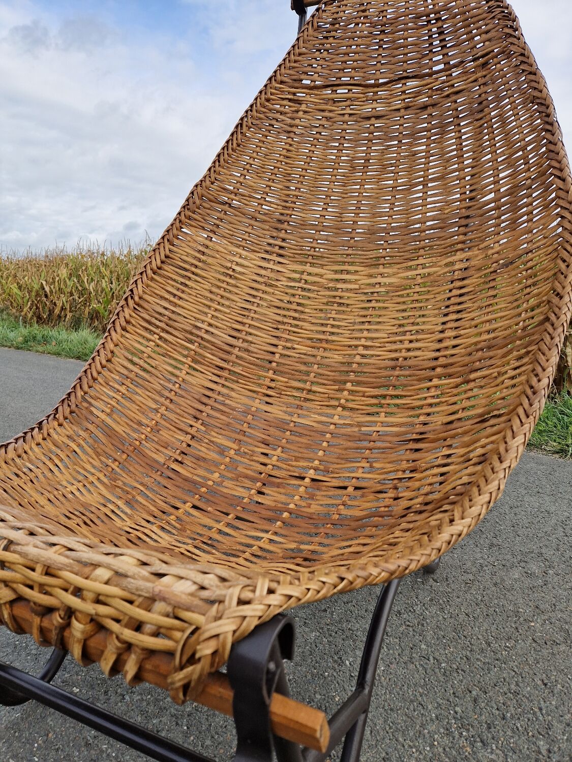 Large vintage metal and wicker armchair