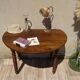 Walnut drop-leaf table with honey spoon legs.