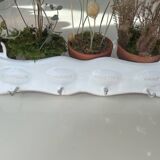 Enamelled sheet metal with inscriptions and hooks