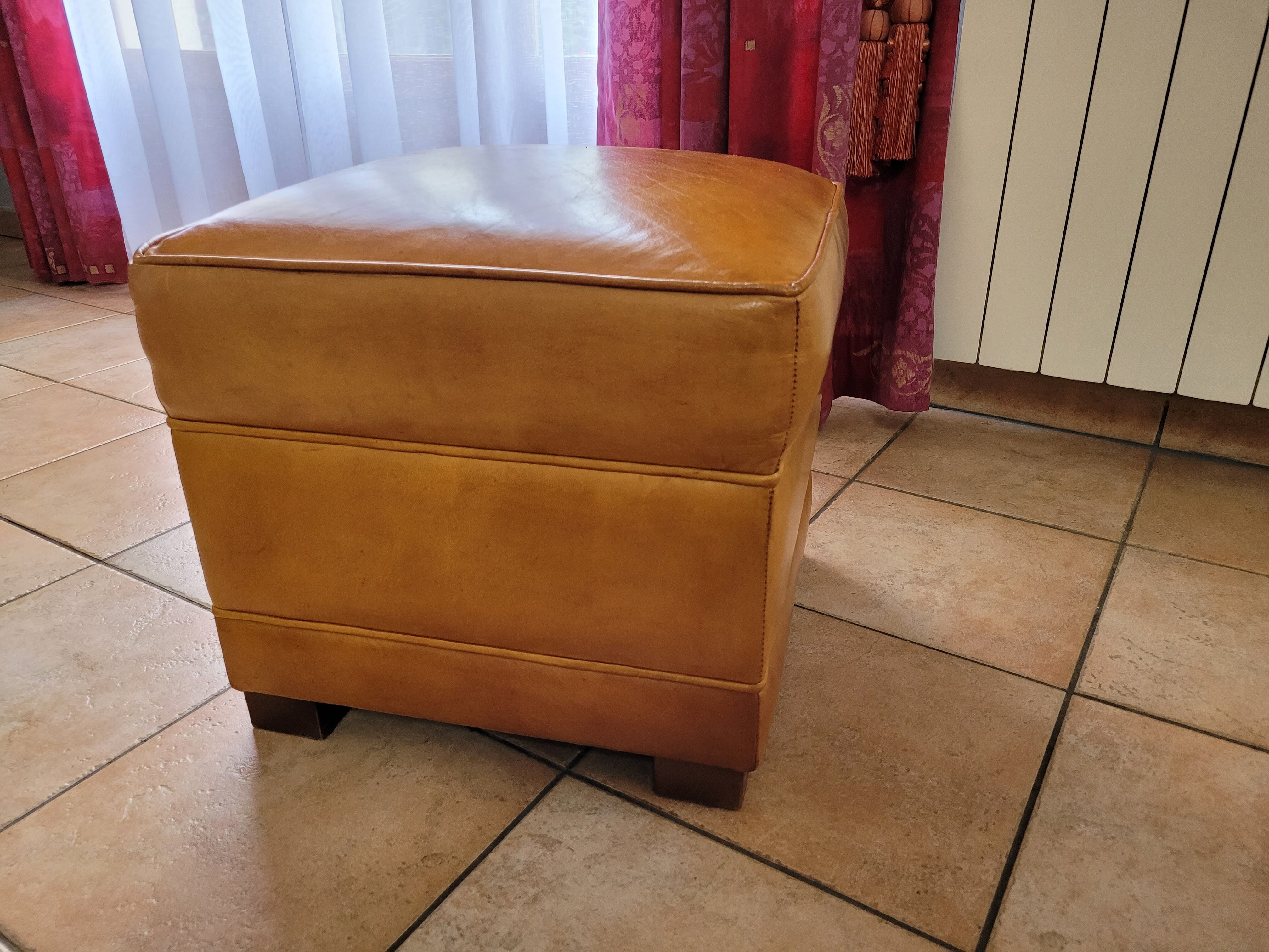 Leather club armchair and its pouf