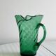 Green blown glass pitcher, unique twisted design