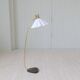 Curved mid-century floor lamp in brass and stone