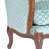 Pair of Louis XV style wingback armchairs with five legs.