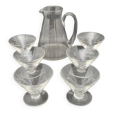 Glass and carafe set with chiseled flower motif