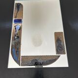 Mirror with ceramic inclusion