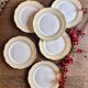 Set of 6 vintage white dinner plates with yellow and gold trim.
