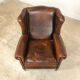 Dark brown sheep leather wingback armchair