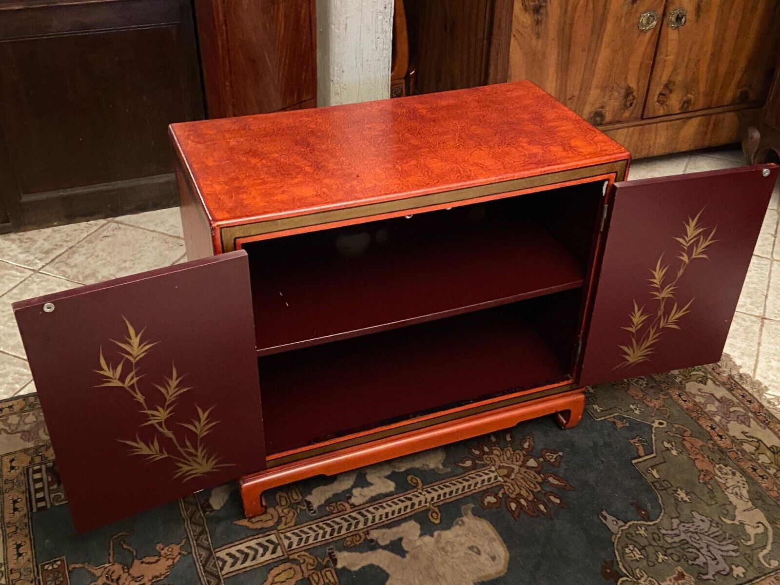 Low sideboard with lacquered decoration with birds on orange background Far East China Japan