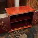 Low sideboard with lacquered decoration with birds on orange background Far East China Japan