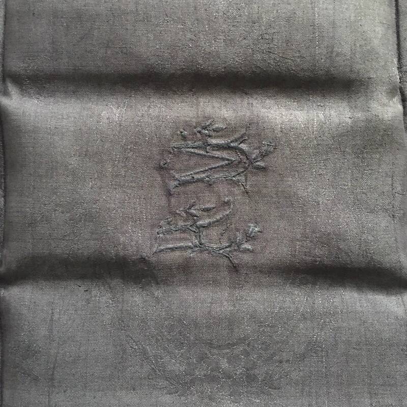 Old embroidered table napkin MA dark grey