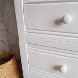 Old white asymmetrical chest of drawers