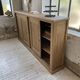 Large row of solid oak loom sliding doors