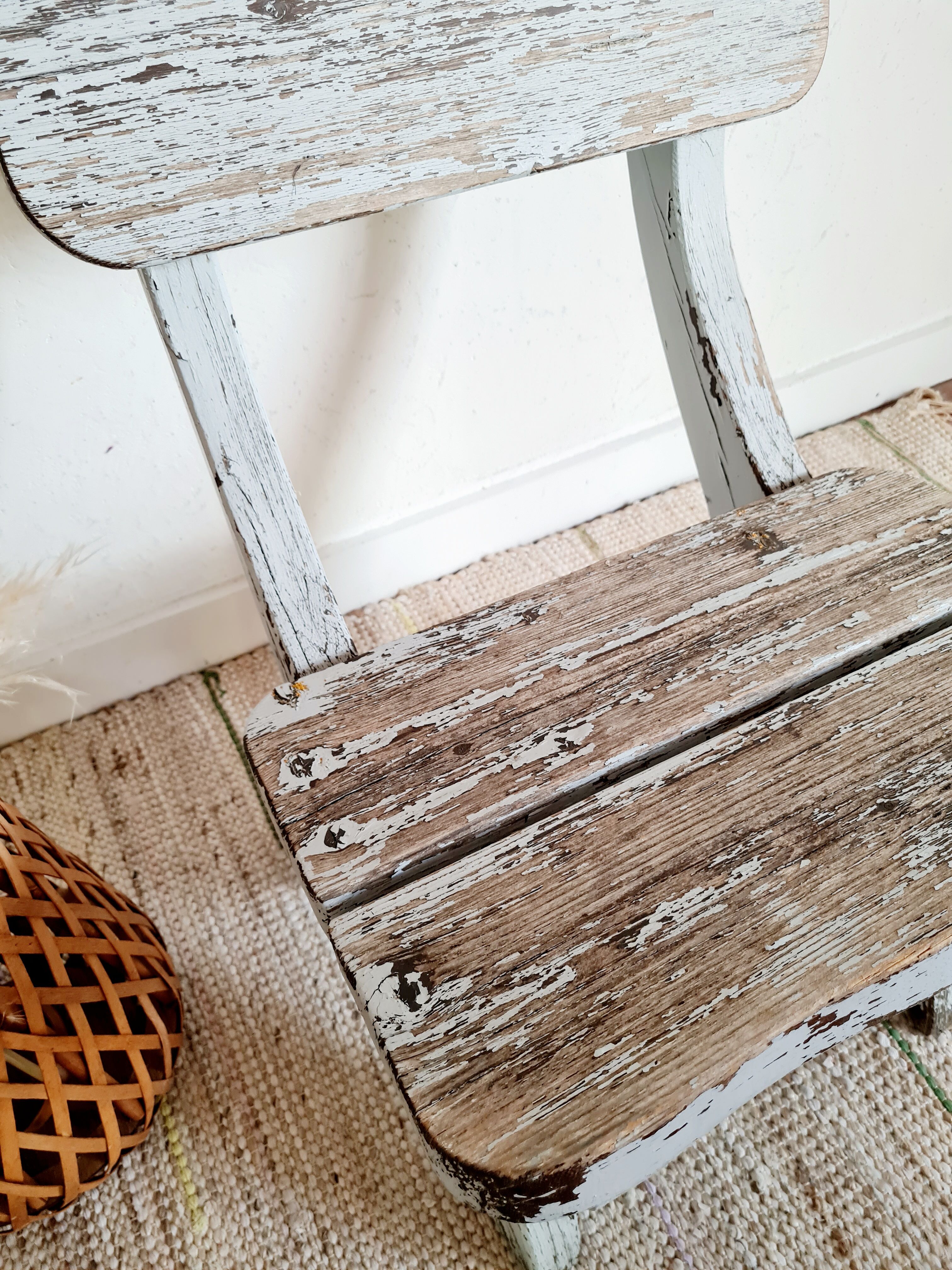 Patinated white old garden chair