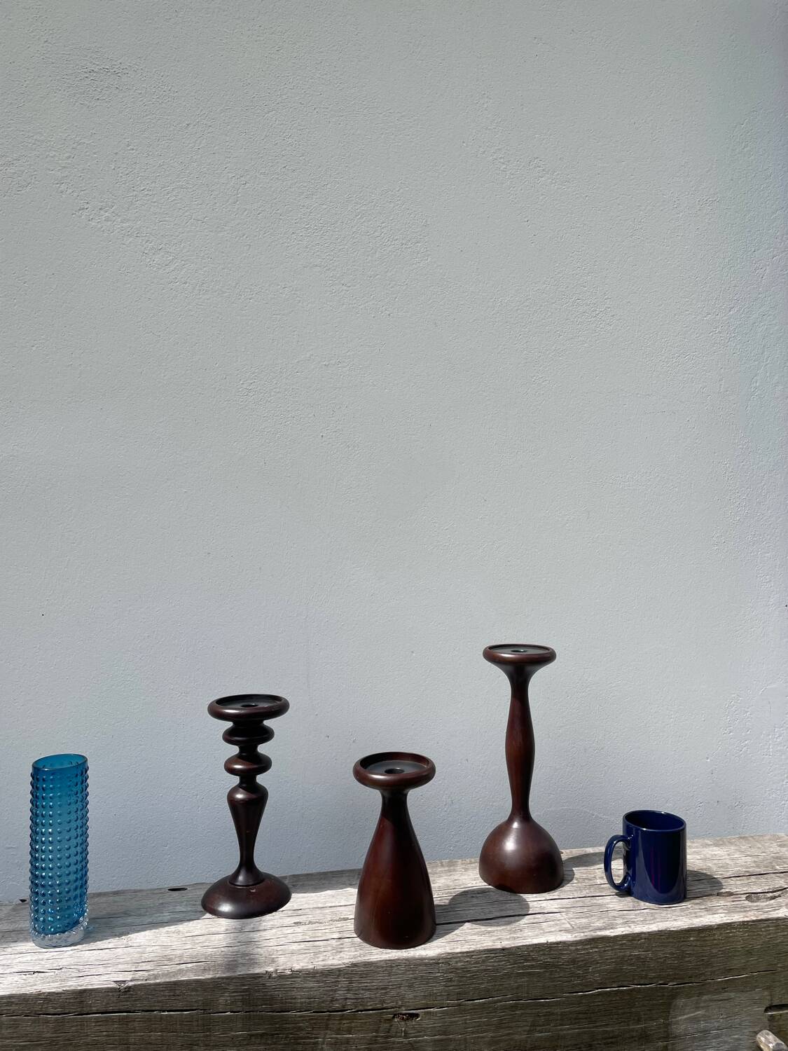 Trio of large turned wooden candlesticks