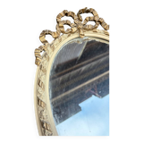 Small old oval gilded mirror
