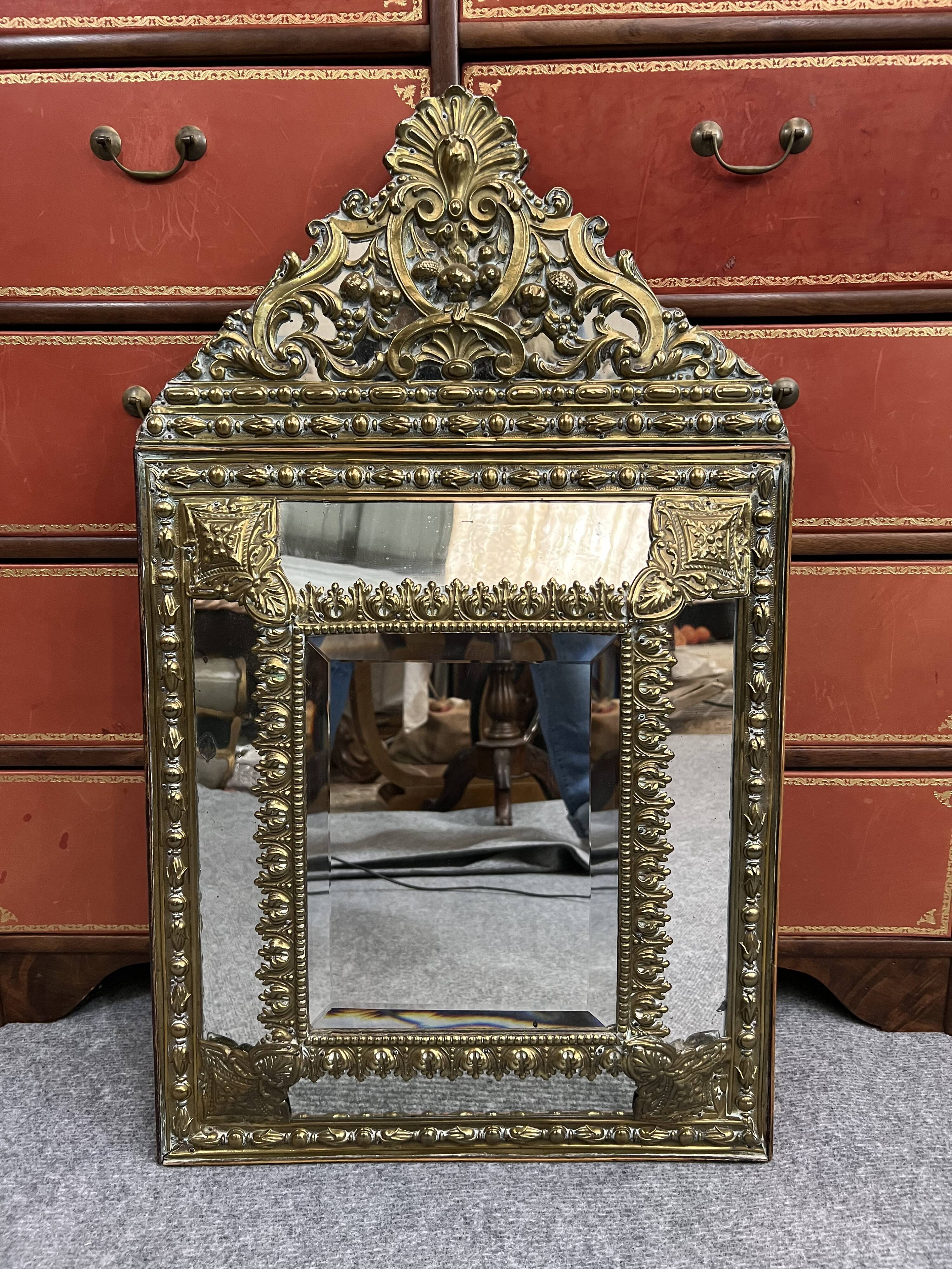 Old repoussé brass pareclose mirror