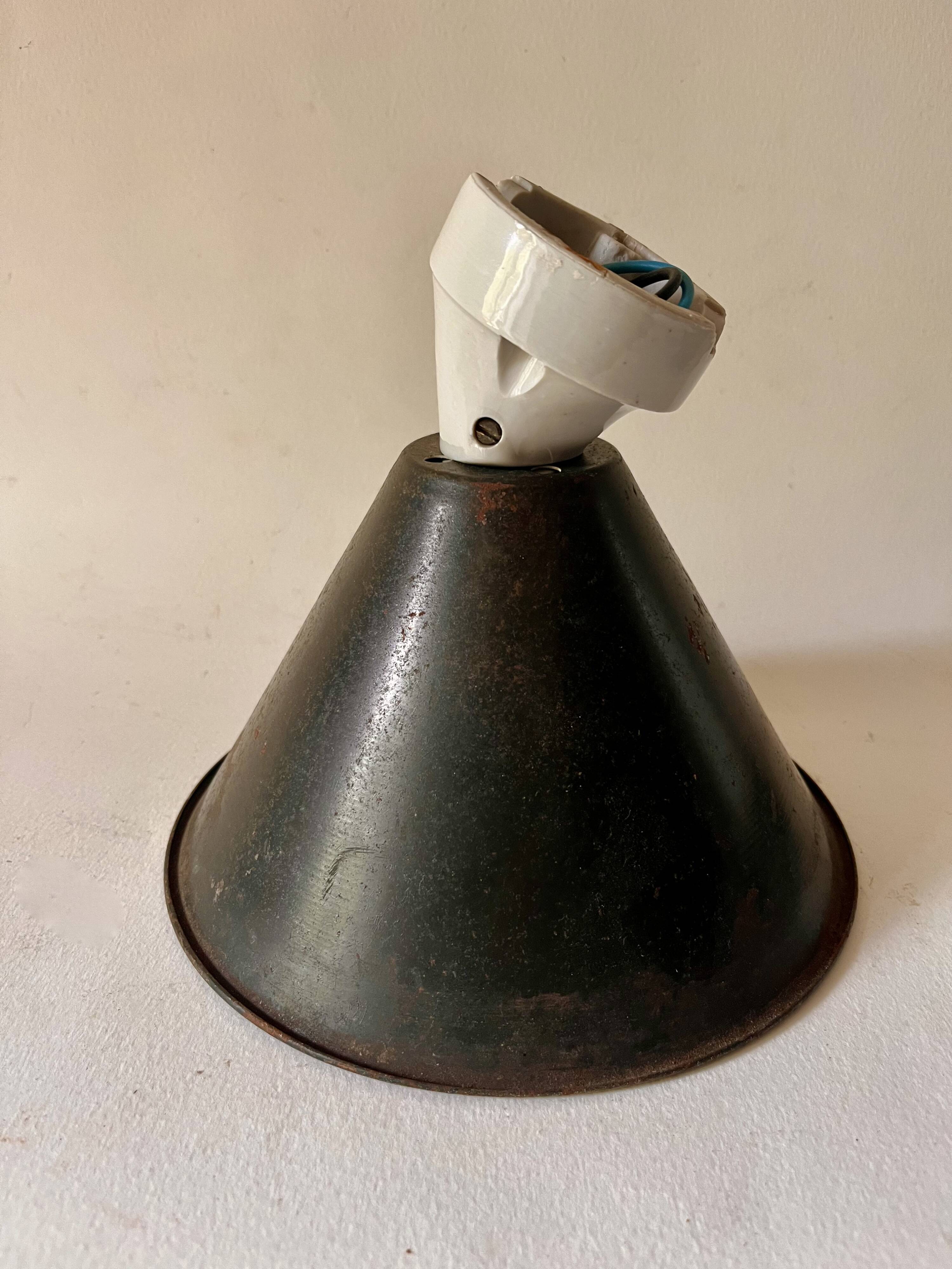 Conical wall light on porcelain base