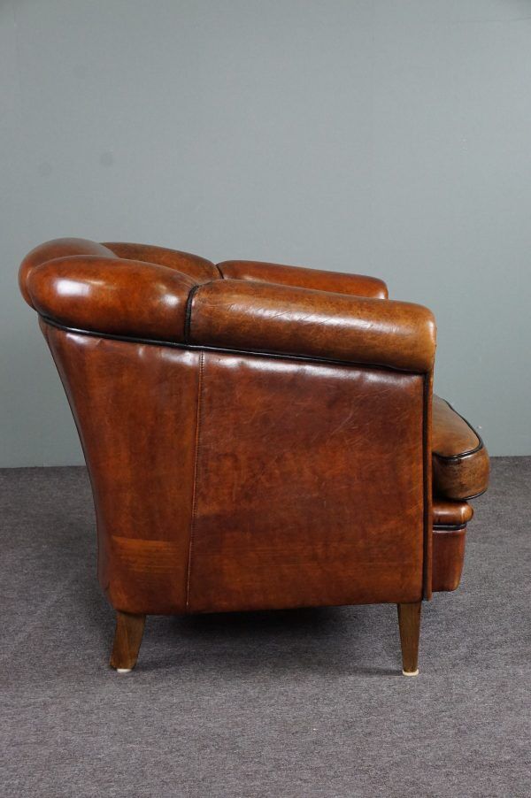 Club armchair in warm coloured sheepskin