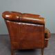 Club armchair in warm coloured sheepskin