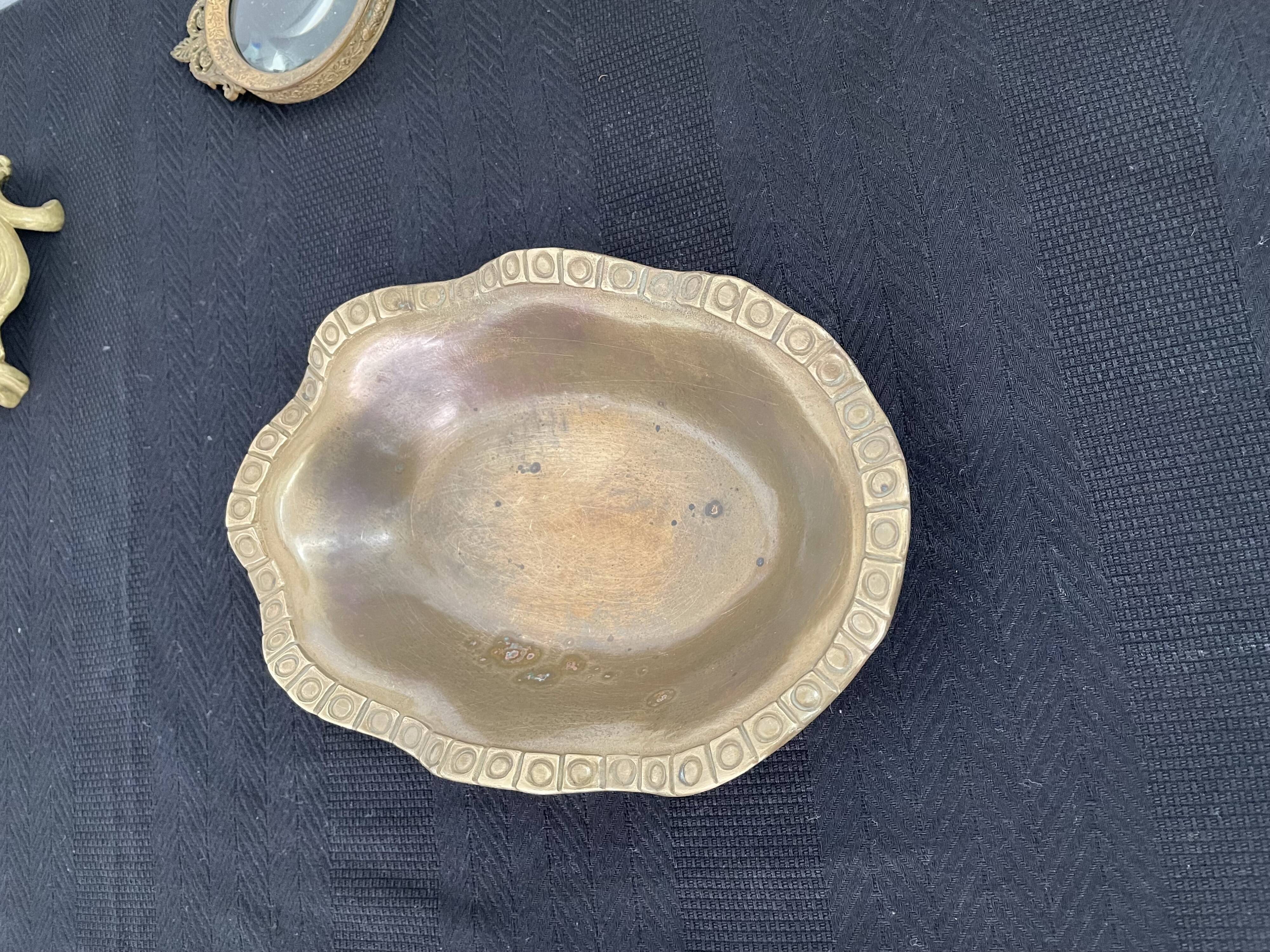 Antique hammered brass cup - pocket empty - golden - frieze