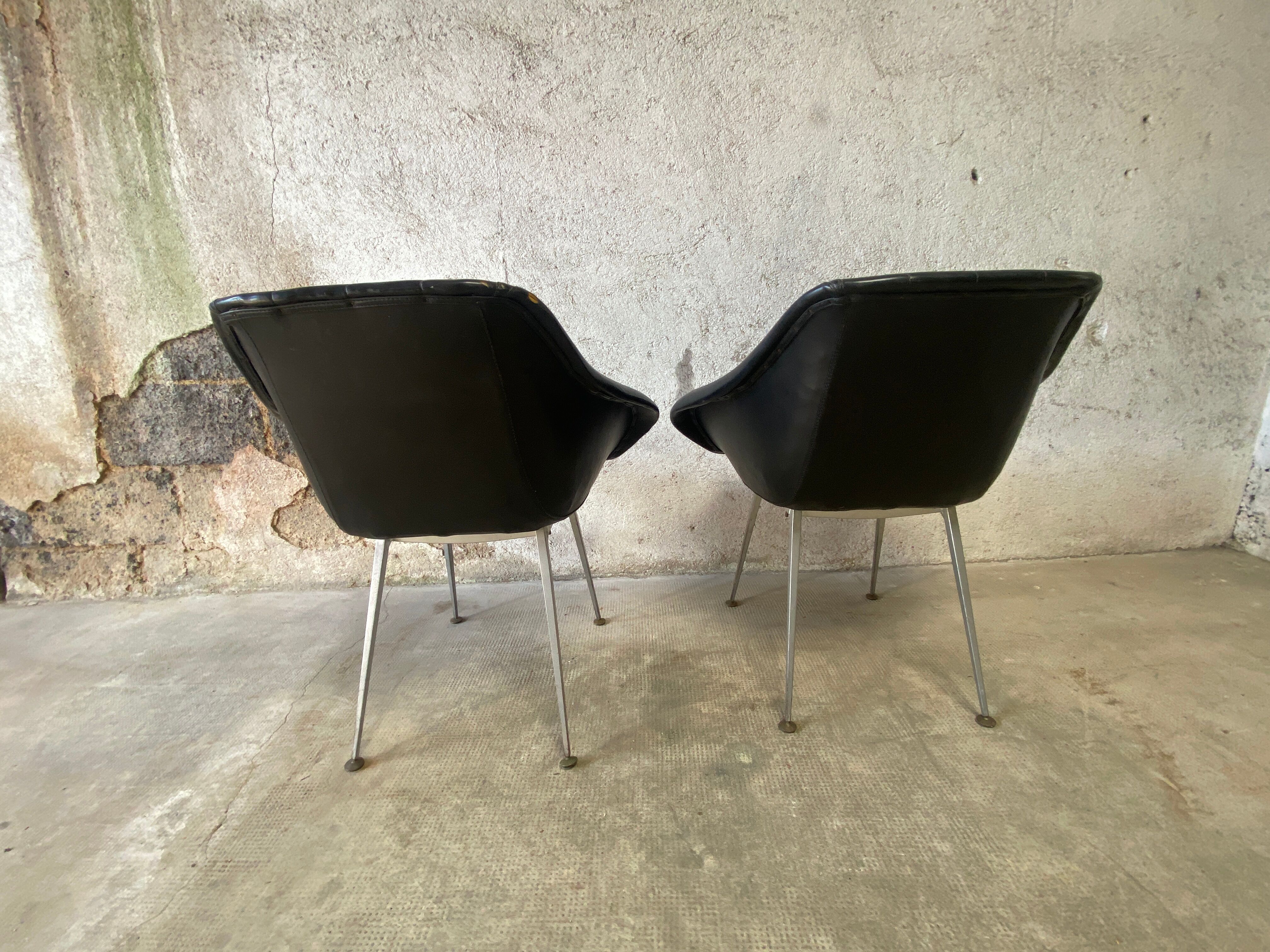 Pair of upholstered armchair year 60