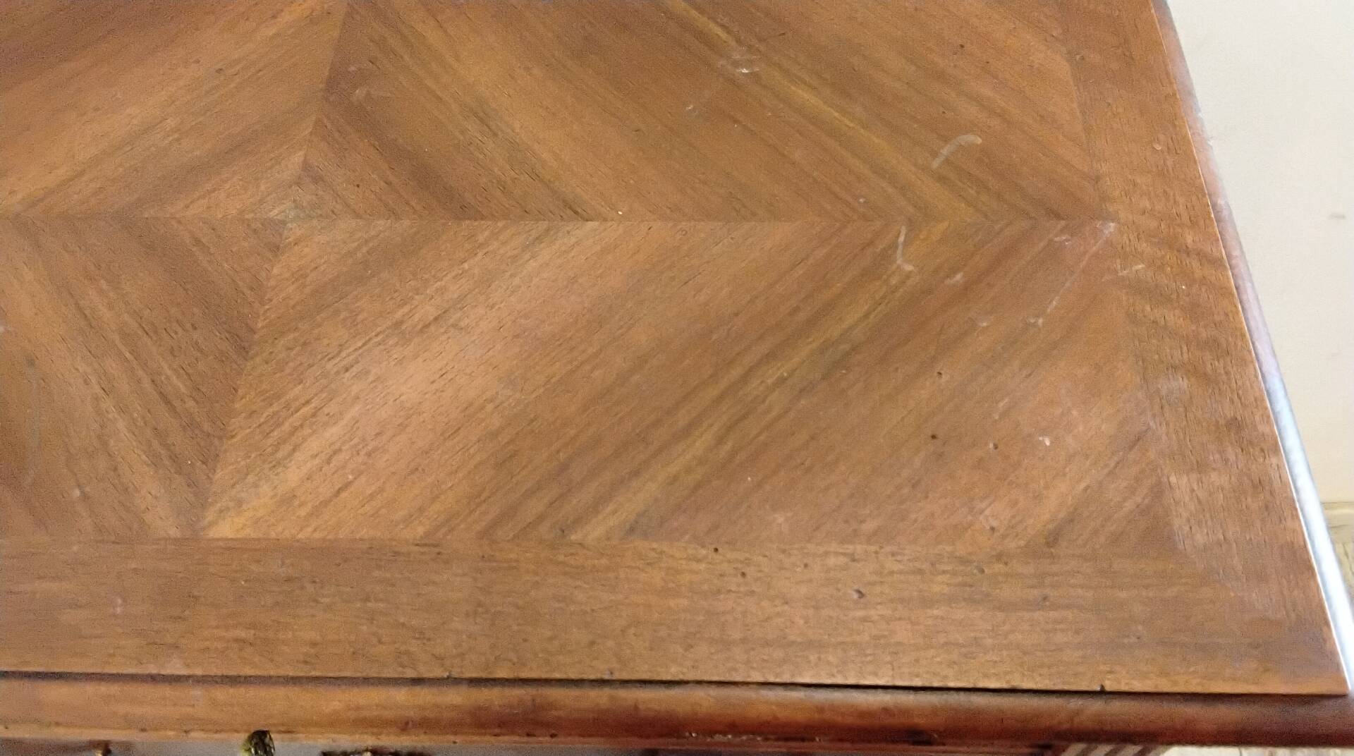 Antique marquetry commode in the Louis XVI style.