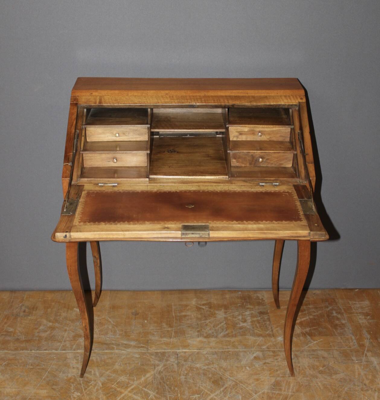 Louis XV donkey back desk in 18th century walnut