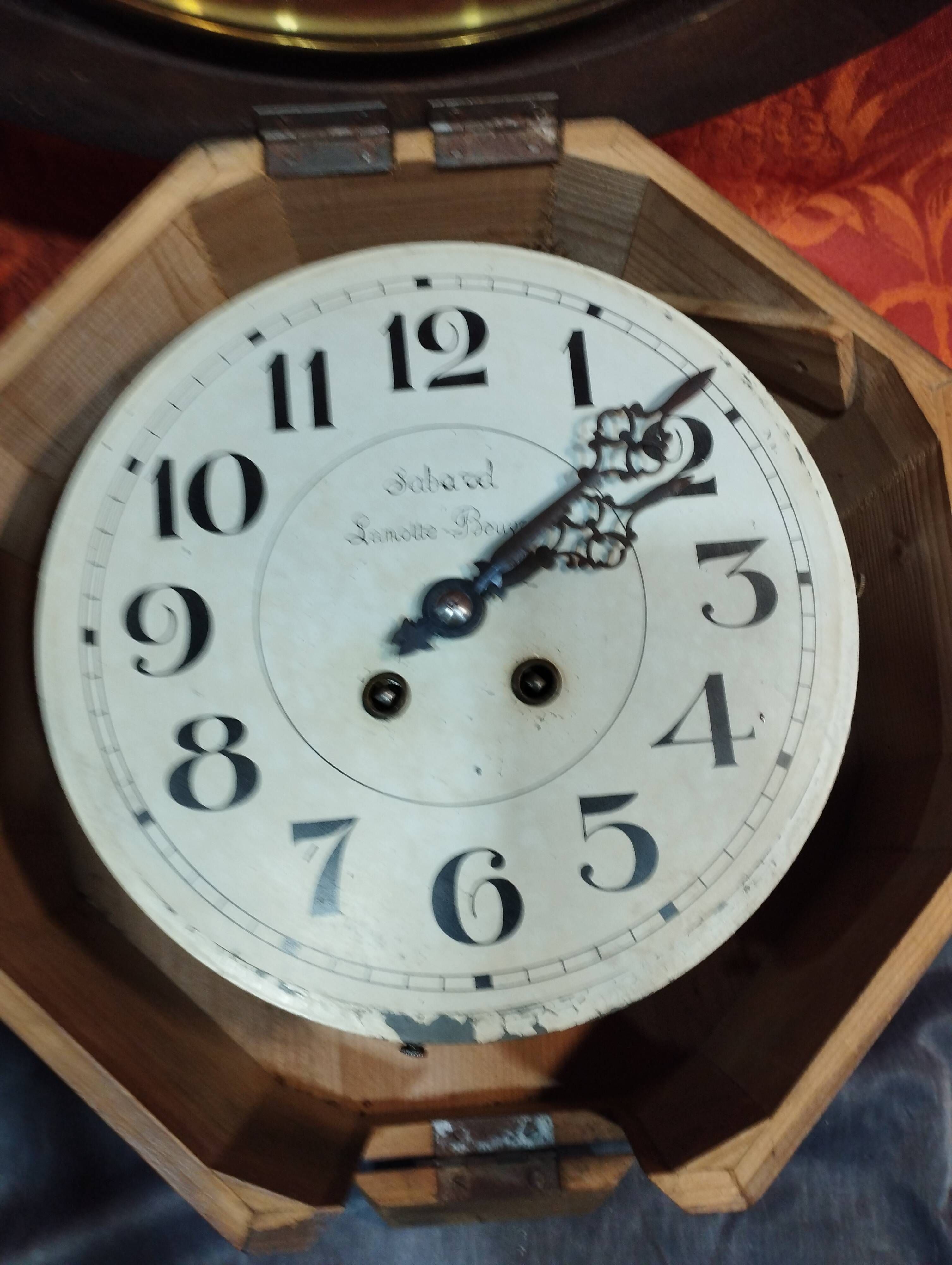 Old round porthole bull's eye wall clock in its wooden case + pendulum + key