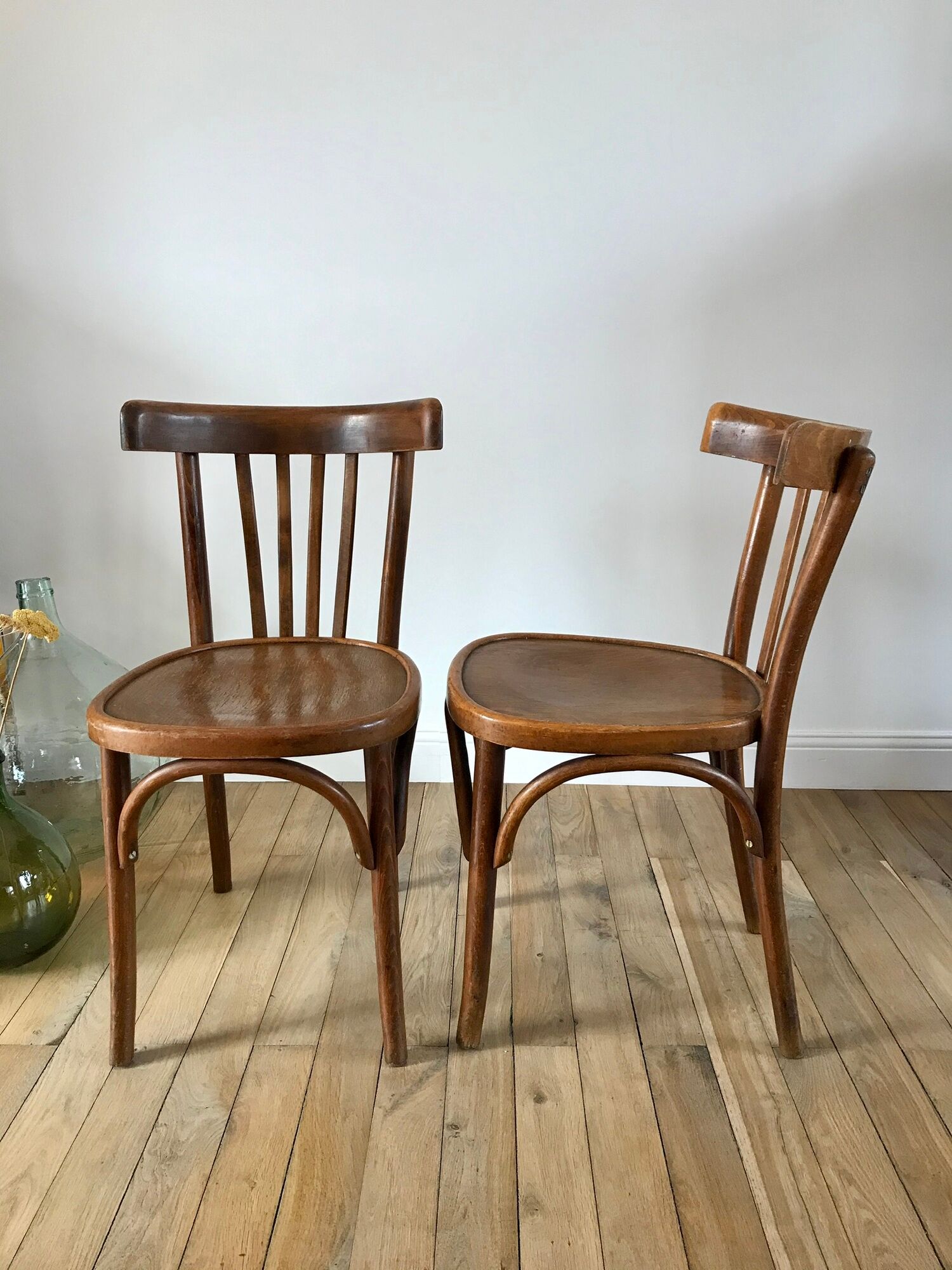 Pair of Baumann curved wood bistro chairs early twentieth century