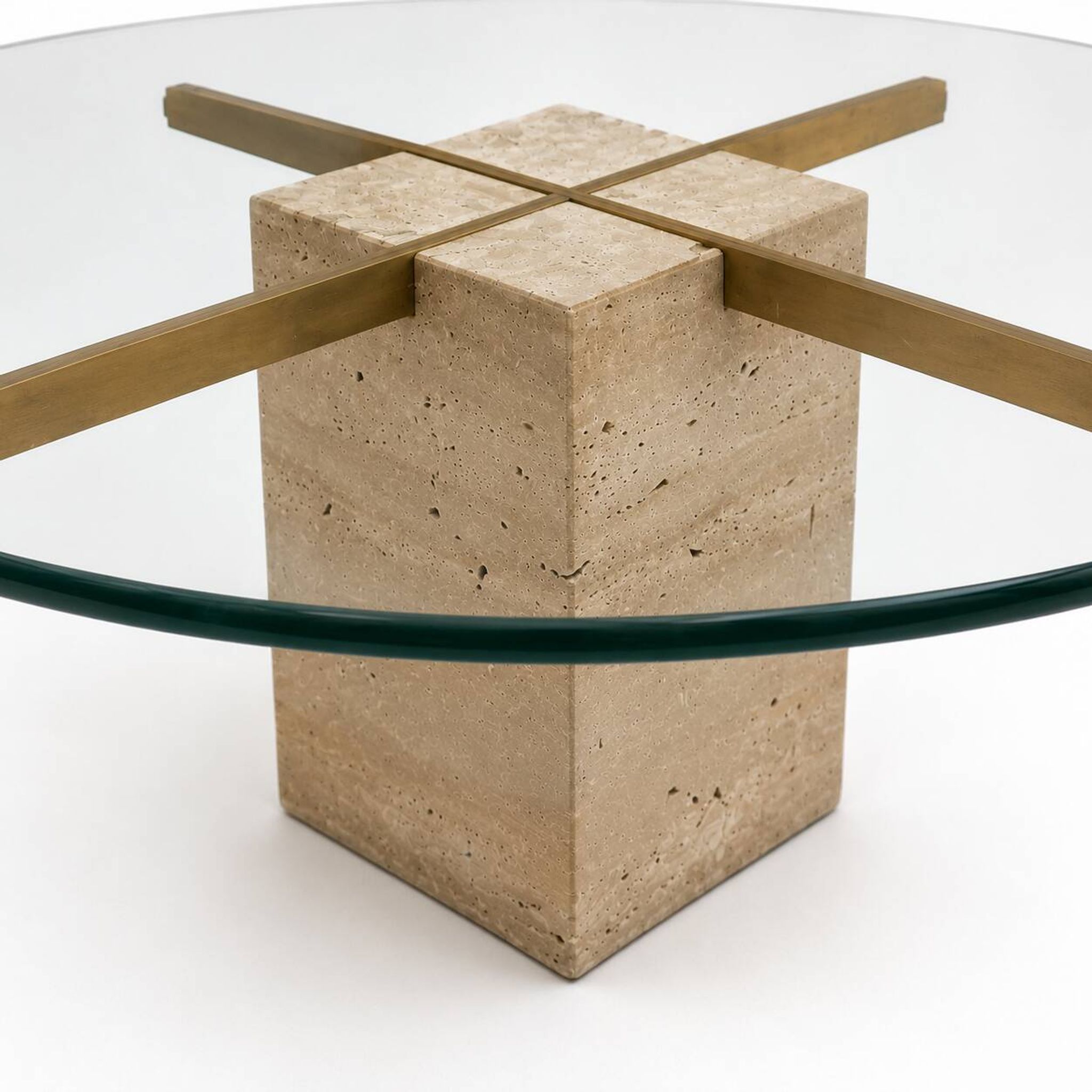 Vintage round coffee table with thick glass top and travertine and brass base