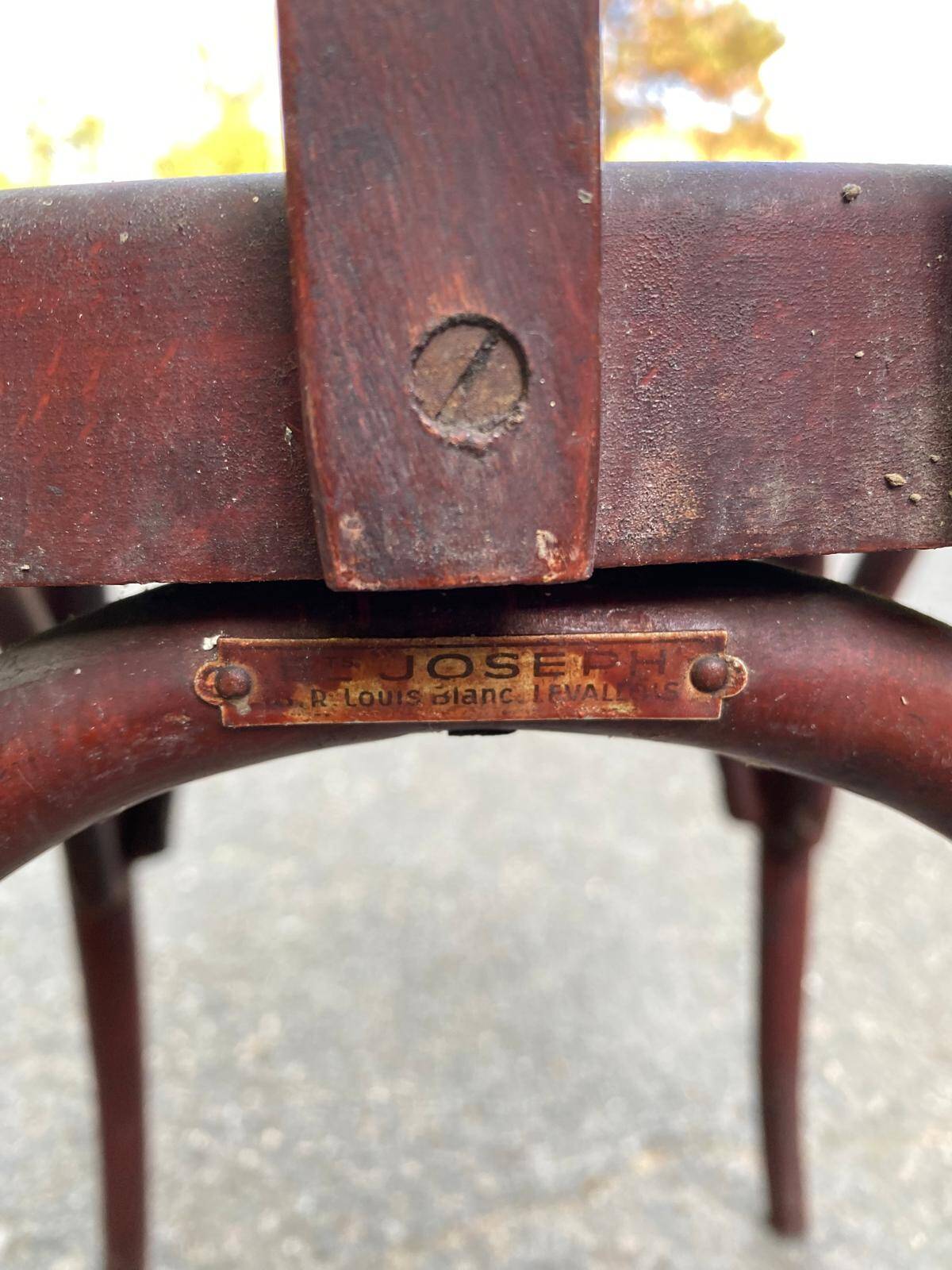2 burgundy curved wooden bistro chairs from Ets Joseph Levallois