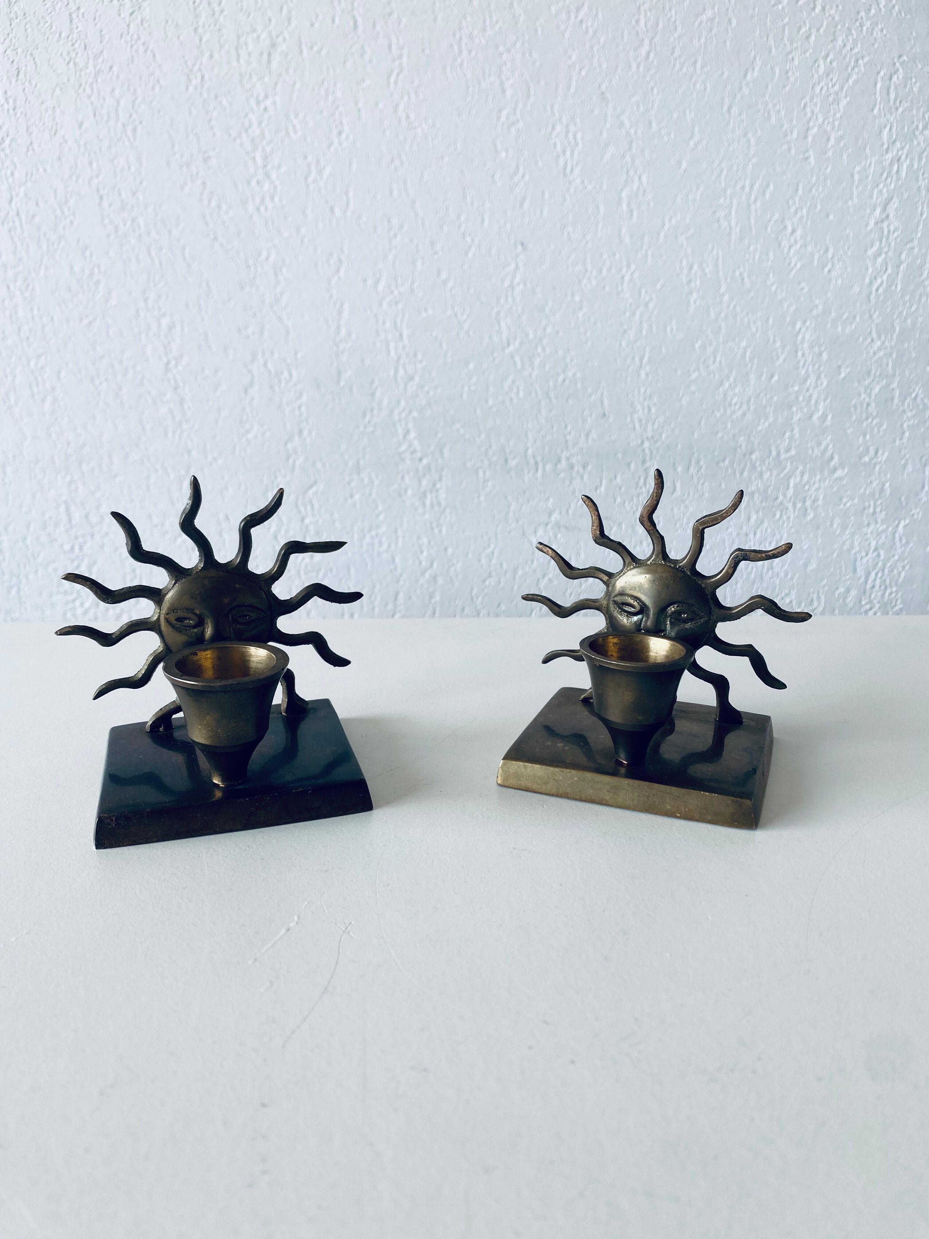 Pair of sun candle holders