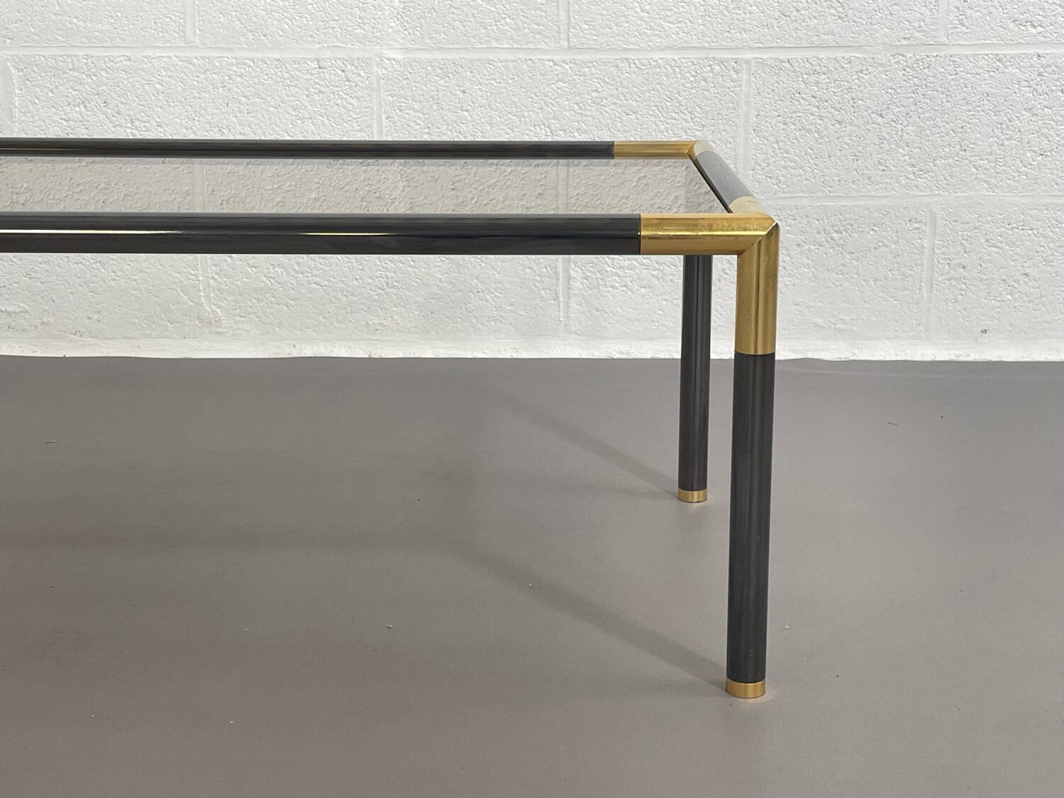 Gunmetal gold metal and smoked glass coffee table from the 70s